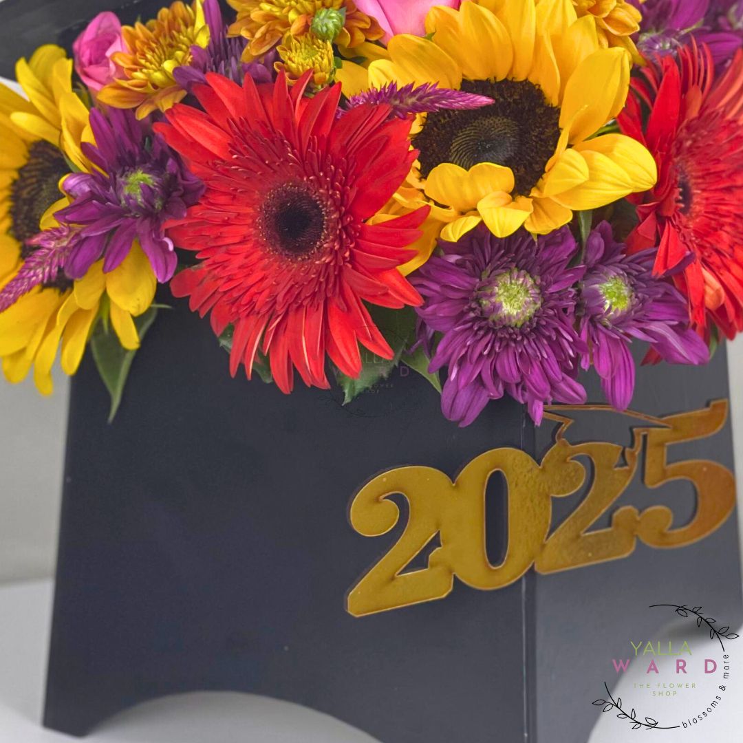 Colorful bouquet of flowers with a black stand displaying '2025' on a white background.