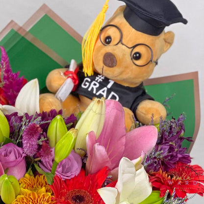 Graduation-themed teddy bear with flowers and a diploma