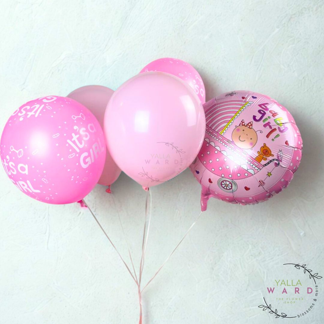 Pink balloons with baby-themed designs on a light background