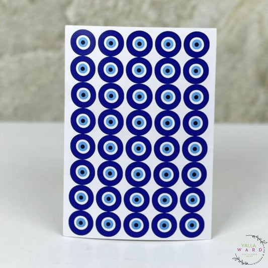 Sheet of blue and white circular stickers on a white card with a blurred background