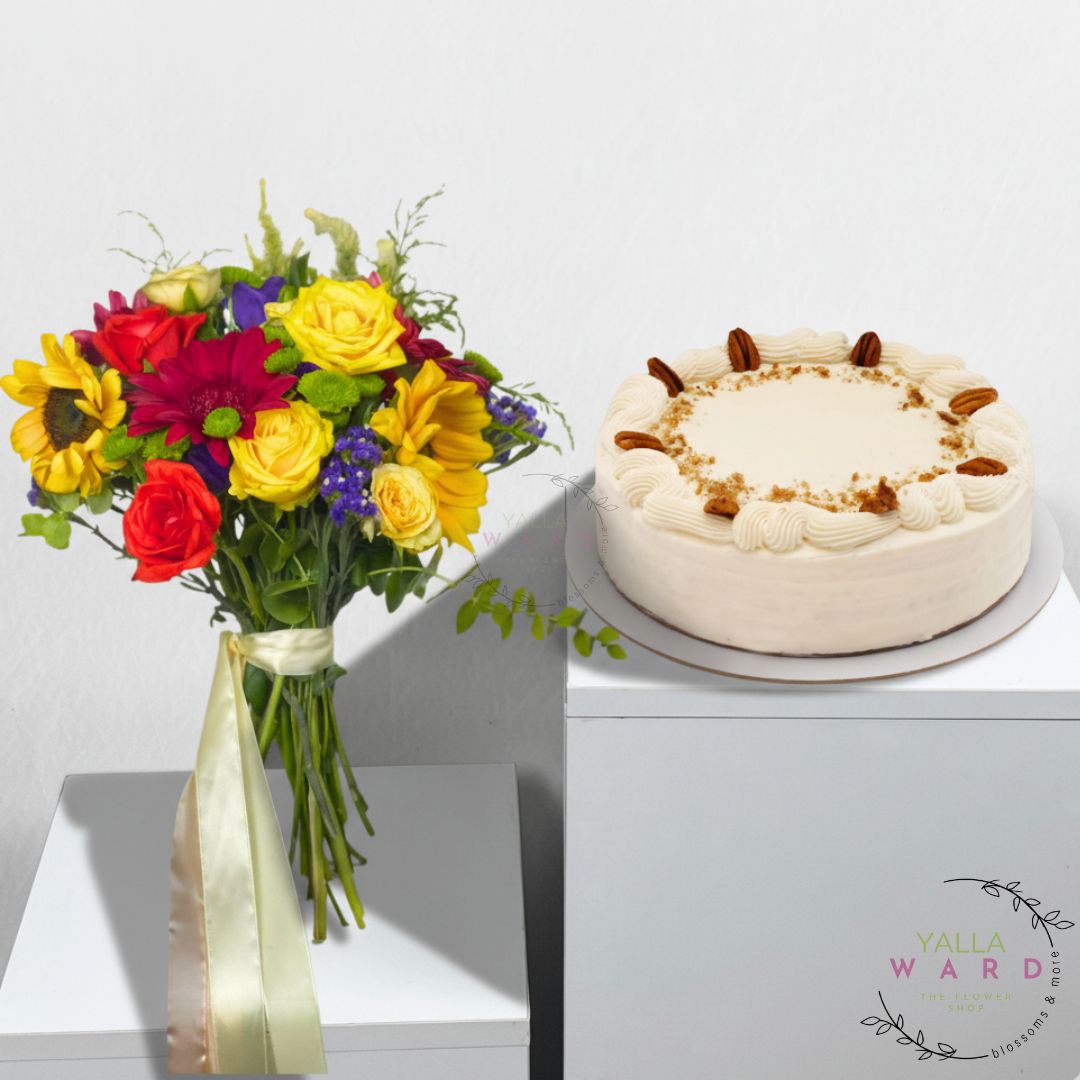 Colorful bouquet of flowers and a cake on a white surface with 'Yalla Ward' branding.