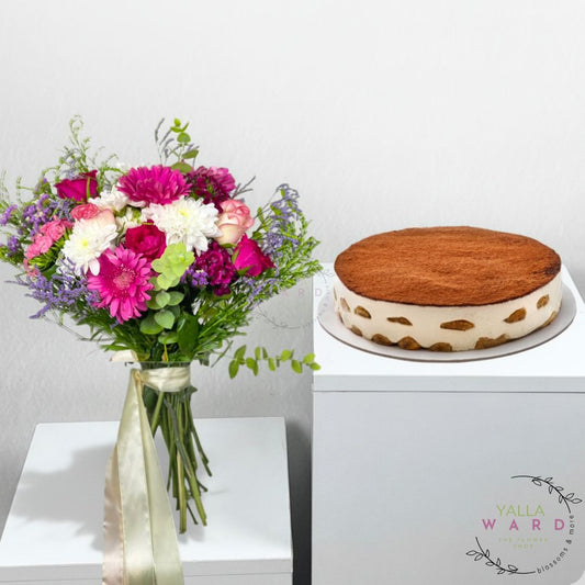 Bouquet of flowers and a cake on a white surface with 'Yalla Ward' branding.